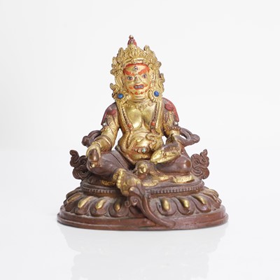 Lot 94 - A Tibetan gilt-bronze bodhisattva