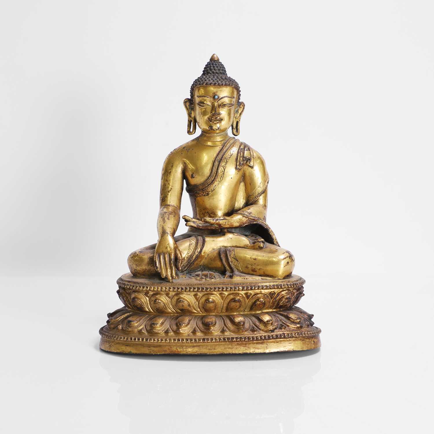 Lot 148 - A Tibetan gilt-bronze Shakyamuni Buddha