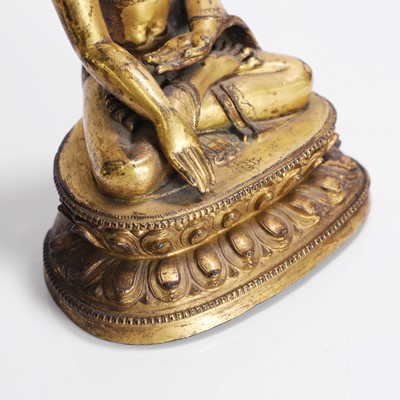 Lot 148 - A Tibetan gilt-bronze Shakyamuni Buddha