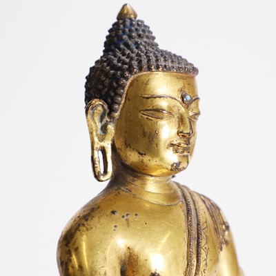 Lot 148 - A Tibetan gilt-bronze Shakyamuni Buddha