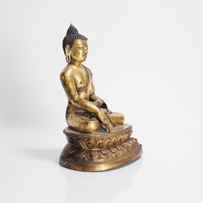 Lot 148 - A Tibetan gilt-bronze Shakyamuni Buddha