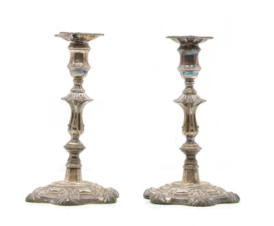 Lot 53 - A pair of George II-style silver plated candlesticks