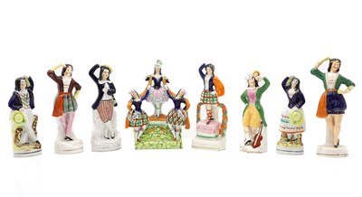 Lot 142 - A group of eight Staffordshire pottery figures