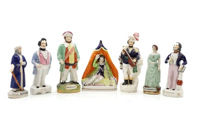 Lot 109 - A collection of seven Staffordshire pottery theatrical figures