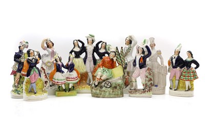 Lot 105 - A collection of ten Staffordshire pottery figures