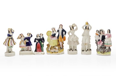 Lot 152 - A group of seven Staffordshire pottery figures