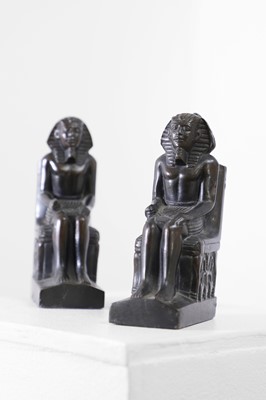 Lot 567 - A pair of Egyptian Revival patinated metal bookends