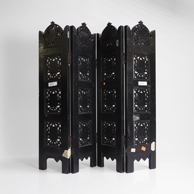 Lot 147 - An Anglo-Indian carved hardwood table screen