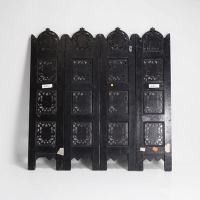 Lot 147 - An Anglo-Indian carved hardwood table screen