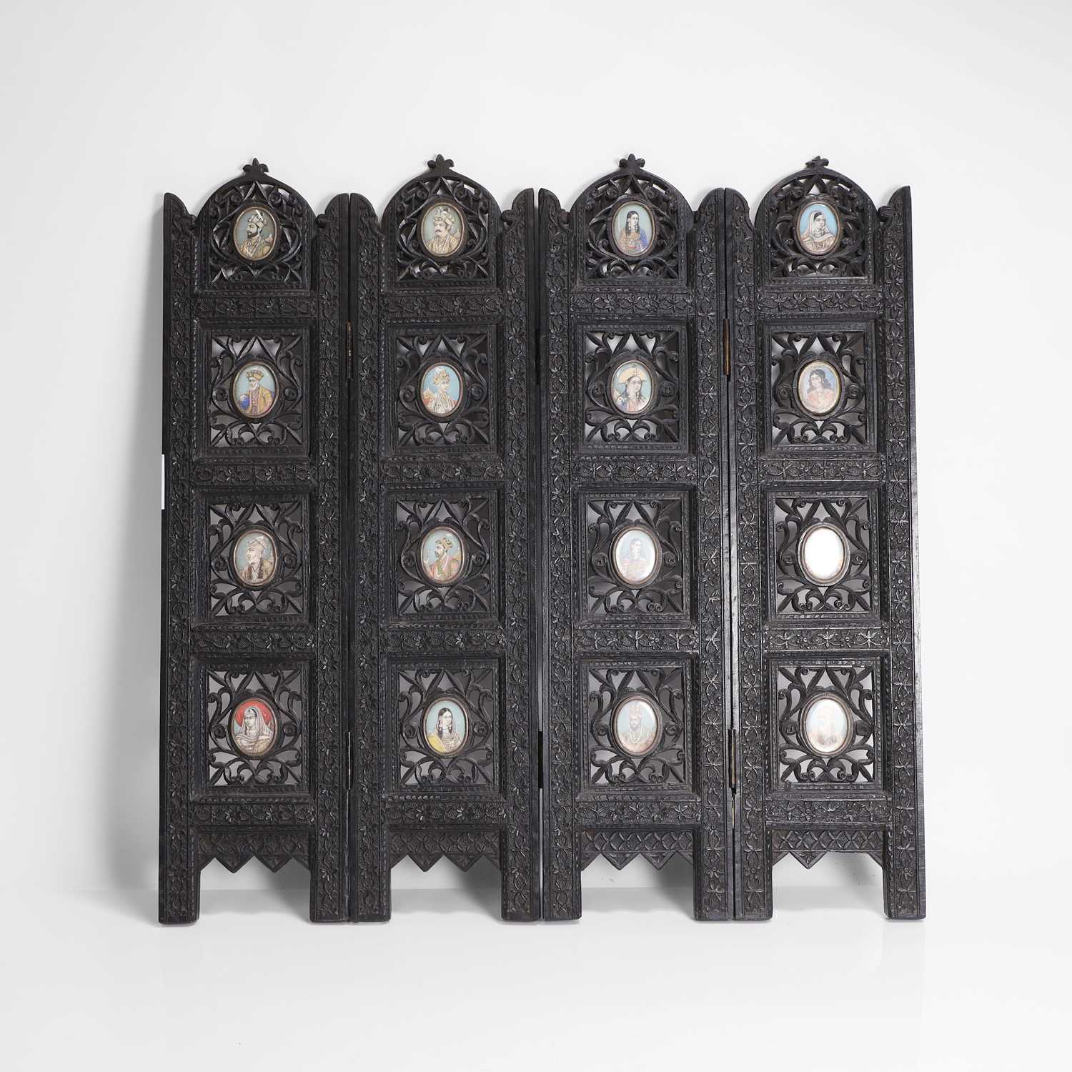 Lot 147 - An Anglo-Indian carved hardwood table screen