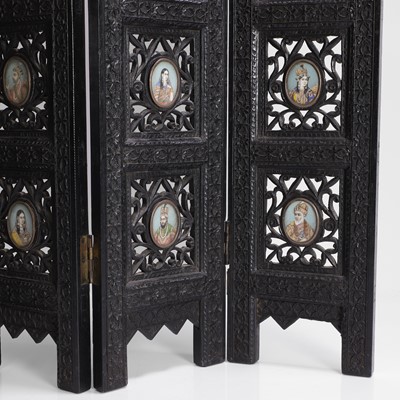 Lot 147 - An Anglo-Indian carved hardwood table screen