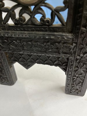 Lot 147 - An Anglo-Indian carved hardwood table screen