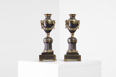 Lot A pair of Louis XVI gilt-bronze and patinated bronze cassolettes