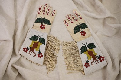 Lot 350 - A pair of Native American beaded hide gauntlets