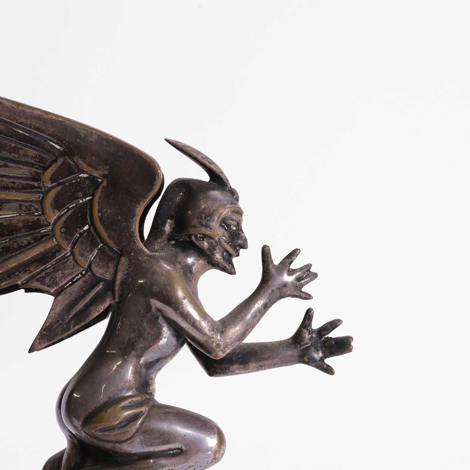 Lot 416 - A winged devil car mascot