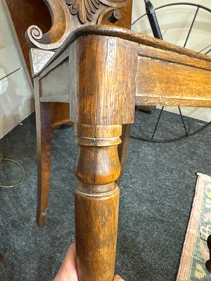 Lot 32 - A pair of Regency oak hall chairs