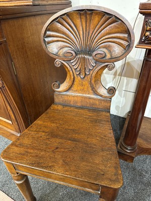 Lot 32 - A pair of Regency oak hall chairs
