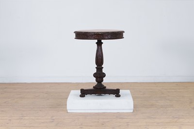 Lot 494 - A carved padouk occasional table