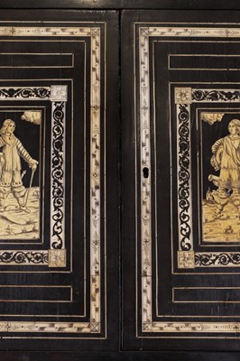 Lot 99 - An ebonised fruitwood, ivory-inlaid and bronze-mounted table cabinet