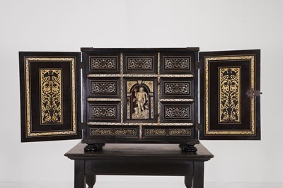 Lot 99 - An ebonised fruitwood, ivory-inlaid and bronze-mounted table cabinet