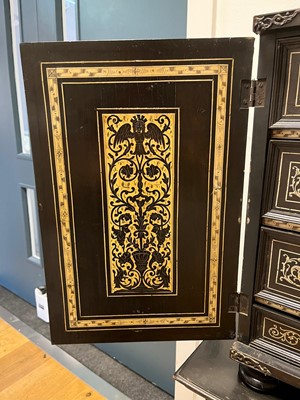 Lot 99 - An ebonised fruitwood, ivory-inlaid and bronze-mounted table cabinet
