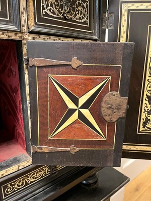 Lot 99 - An ebonised fruitwood, ivory-inlaid and bronze-mounted table cabinet