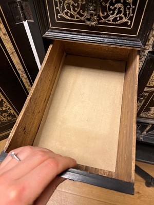 Lot 99 - An ebonised fruitwood, ivory-inlaid and bronze-mounted table cabinet