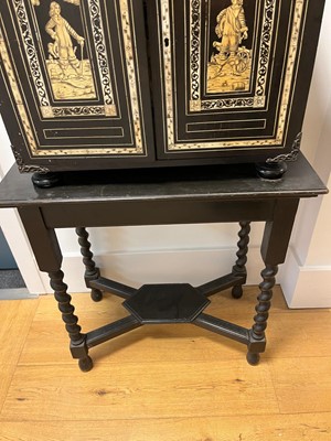 Lot 99 - An ebonised fruitwood, ivory-inlaid and bronze-mounted table cabinet