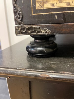 Lot 99 - An ebonised fruitwood, ivory-inlaid and bronze-mounted table cabinet