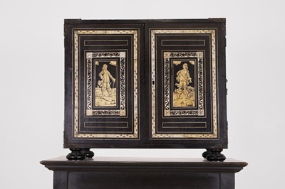 Lot 99 - An ebonised fruitwood, ivory-inlaid and bronze-mounted table cabinet