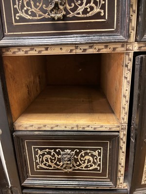 Lot 99 - An ebonised fruitwood, ivory-inlaid and bronze-mounted table cabinet
