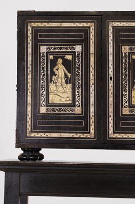 Lot 99 - An ebonised fruitwood, ivory-inlaid and bronze-mounted table cabinet