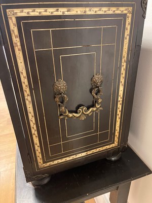 Lot 99 - An ebonised fruitwood, ivory-inlaid and bronze-mounted table cabinet