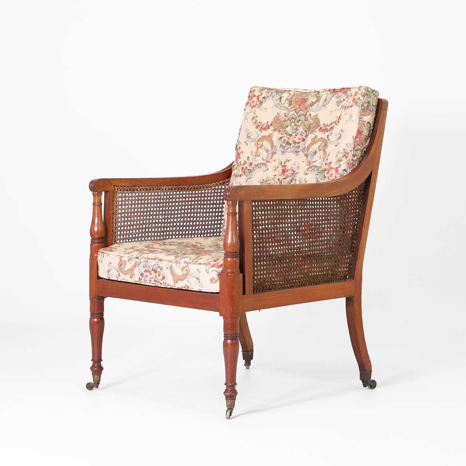 Lot 144 - A Regency mahogany bergère library chair