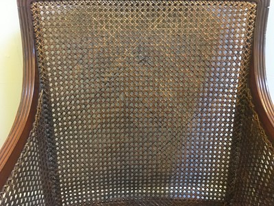 Lot 144 - A Regency mahogany bergère library chair
