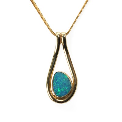 Lot 171 - A free form opal pendant and chain