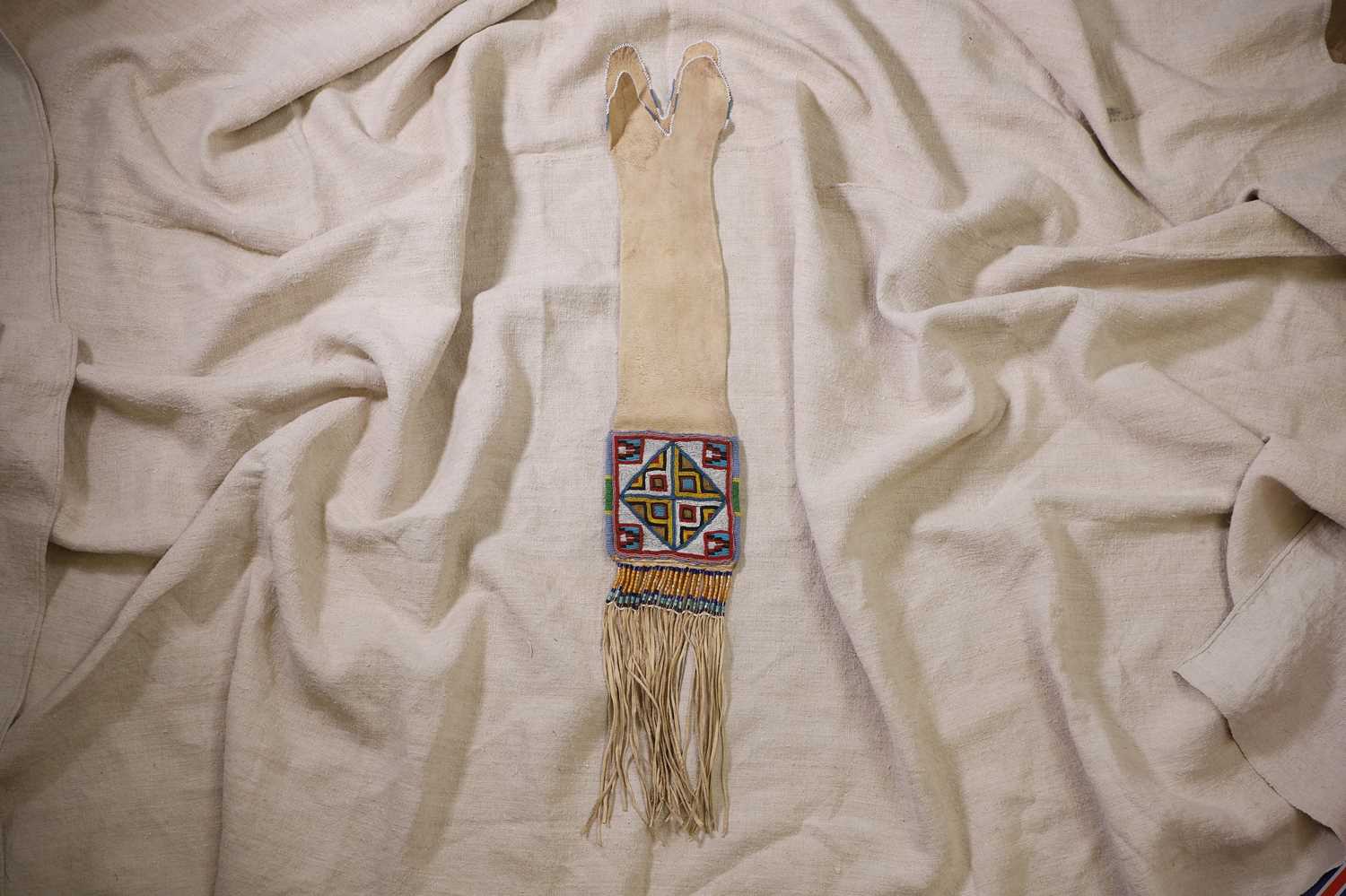 Lot 365 - A Native American beaded hide tobacco or pipe bag