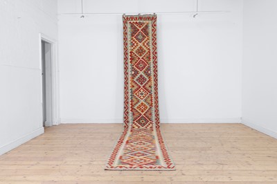 Lot 258 - An oversized flat-weave wool runner