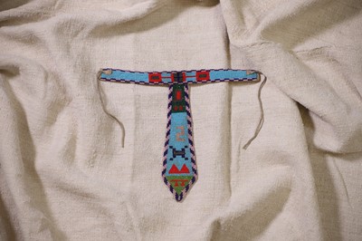 Lot 340 - A Native American beaded hide child's collared tie