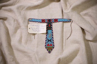 Lot 340 - A Native American beaded hide child's collared tie