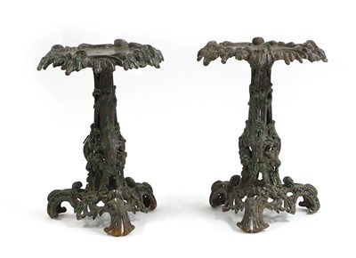 Lot 585 - A pair of cast iron tables