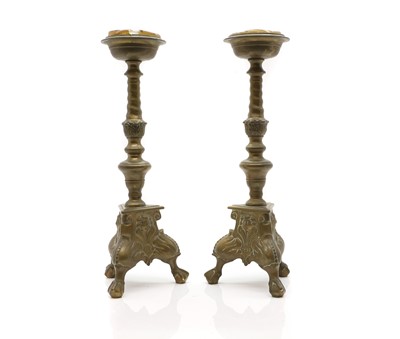 Lot 304A - A pair of gilt brass candlesticks