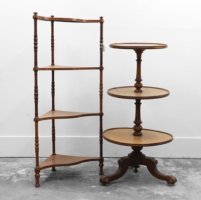Lot 515 - A walnut three tier dumb waiter