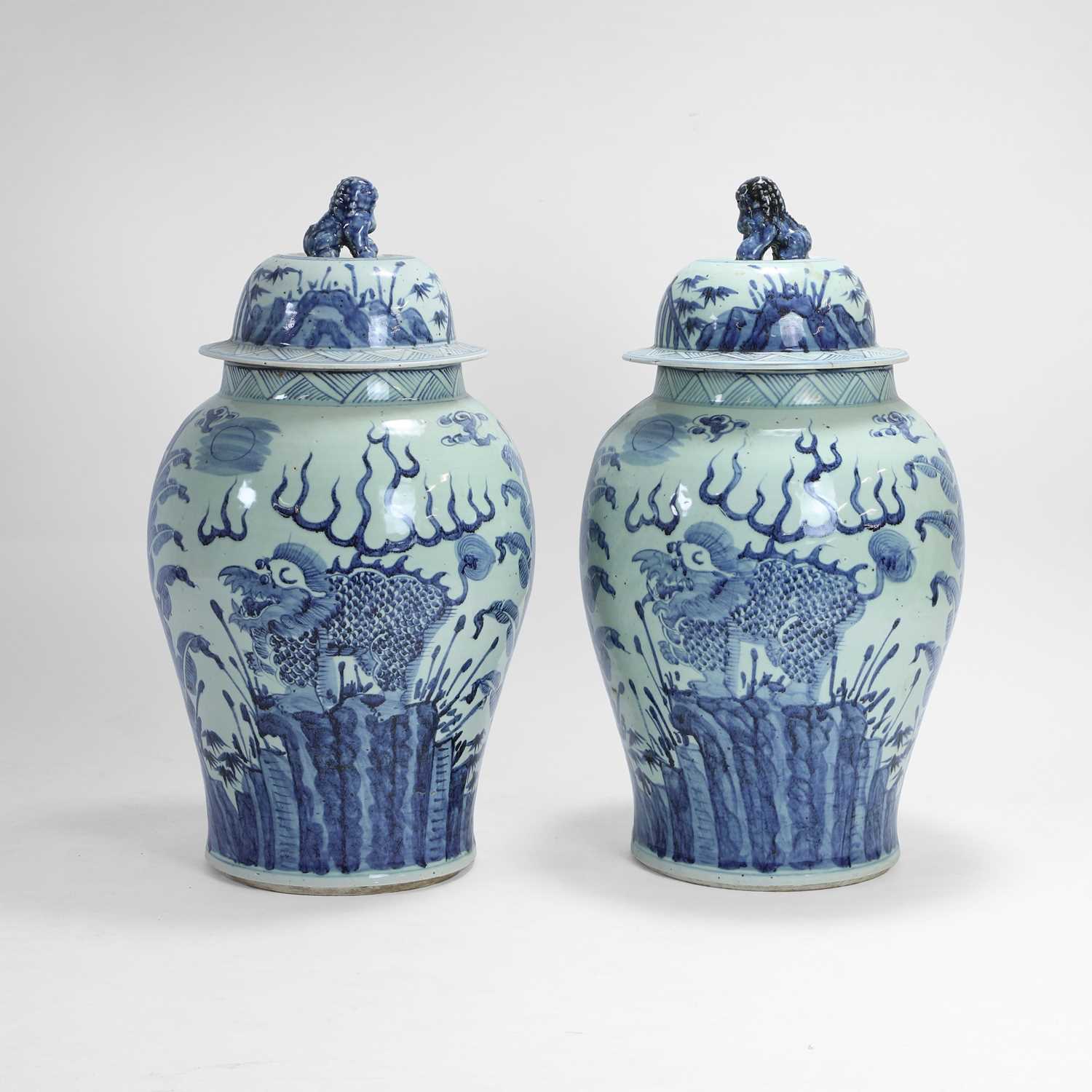 Lot 29 - A pair of large blue and white baluster vases and covers