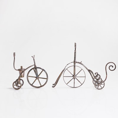 Lot 99 - A silver-plated tricycle bottle stand