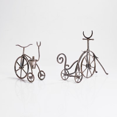 Lot 99 - A silver-plated tricycle bottle stand
