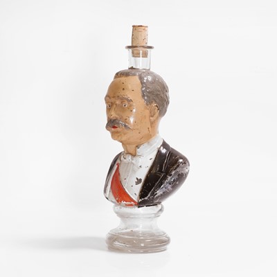 Lot 107 - A polychrome-painted glass figural bottle