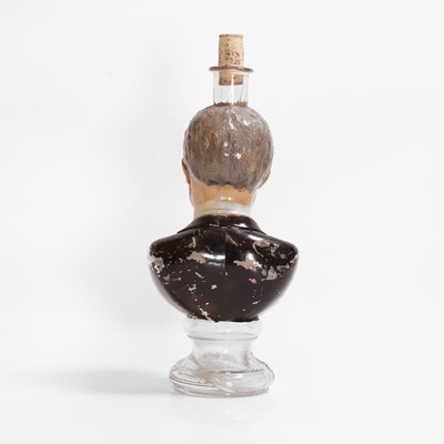 Lot 107 - A polychrome-painted glass figural bottle