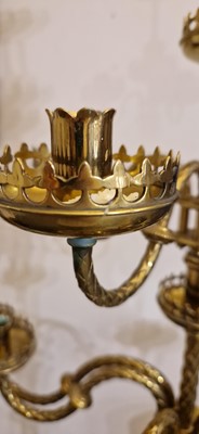 Lot 87 - A pair of large Gothic-style brass candelabra