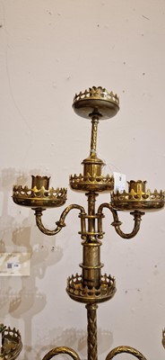 Lot 87 - A pair of large Gothic-style brass candelabra